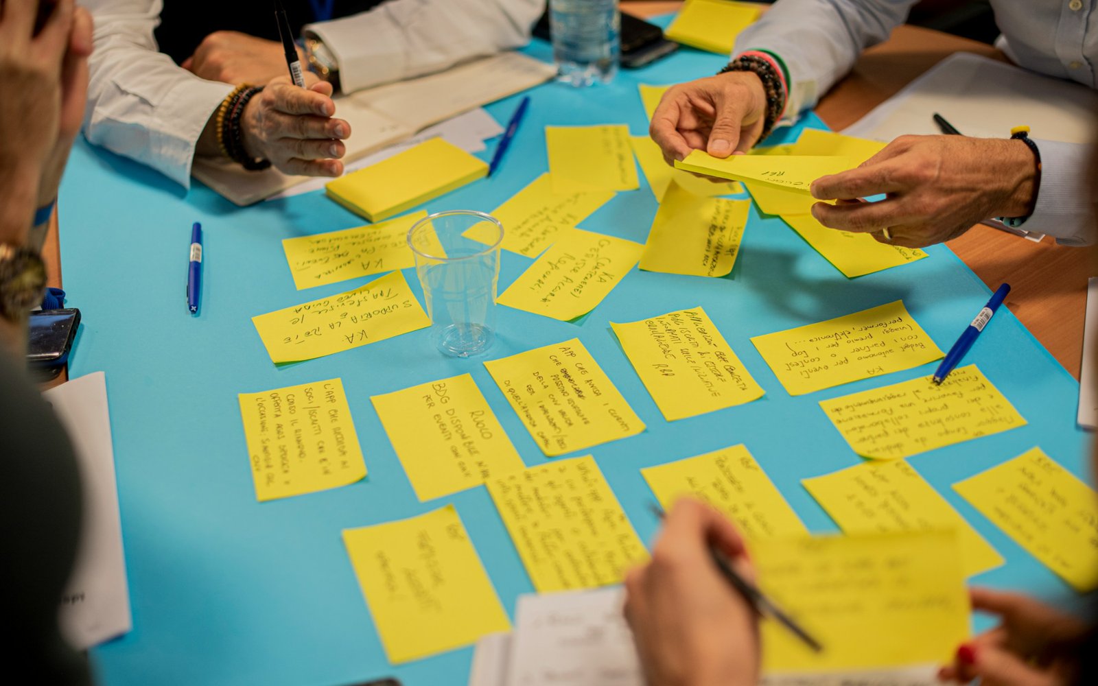Post-it notes arranged on a table during a strategy session.